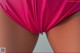 A close up of a woman's butt in a pink bikini.